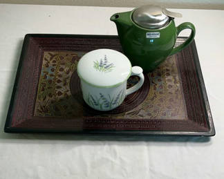 Lot 57: Green teapot with infuser, lavender-patterned cup and lid, on ornate decorative tray