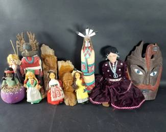385 Group of carved wood figurines, dolls, pin