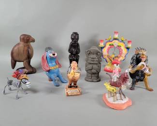 421 Group of terracotta, composite and carved wood
