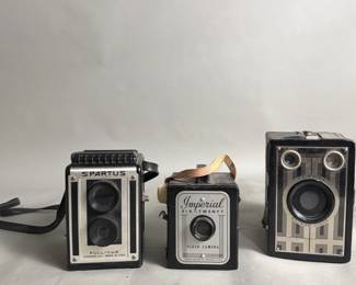 597 3 Vintage cameras and two clocks