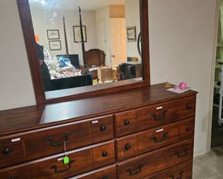 Ashley Furniture Timberline dresser and matching scroll-top mirror.