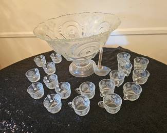 An American pressed glass punch bowl set with pedestal, ladle, and eighteen cups.