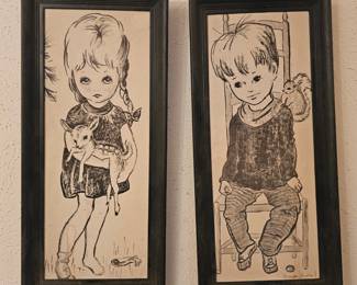 A pair of vintage 1970s big-eye children art prints by Diane Huisel.