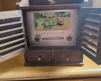 An Audition Model 906 Americana Spice Chest tube radio sold by Woolworth.
