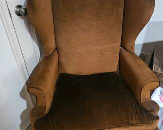 Brown wing back chair