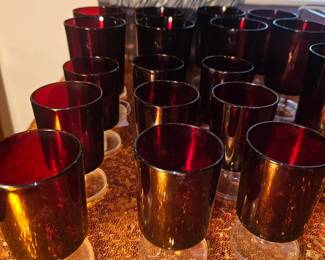 A collection of Arcoroc France ruby red footed water glasses.