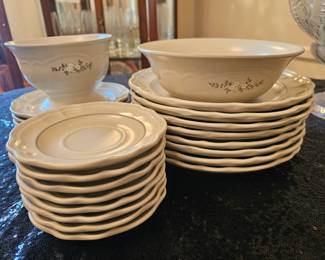 A set of Pfaltzgraff Remembrance pattern stoneware dishes with floral spray.