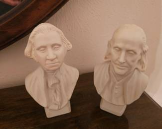 A vintage pair of Avon figural decanters depicting George Washington and Benjamin Franklin.