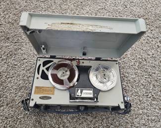A portable Mayfair transistor reel-to-reel tape recorder from the 1960s.