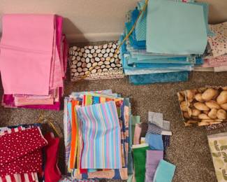 Quilting Fabric Scrap & Pre-Cut Destash LotHuge variety of quilting-weight cotton fabric pieces perfect for scrappy quilts, applique, masking, or small sewing crafts! Sorted cleanly into color-coordinated piles.Includes: Stacks of pinks, reds/patriotic prints, vibrant stripes, multi-colored dots, solid and textured blues/aquas, purples, greens, and neutrals (including a fun potato print!).Condition: Unwashed, clean, and stored safely in a smoke-free home. Mixture of fat quarters, strips, and various scrap sizes.