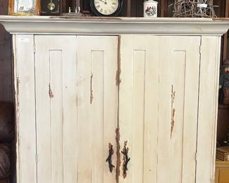 Whitewashed wood cabinet with double doors