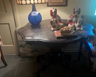 Large dark marble top turtle table, blue glass lamp and Staffordshire style dogs