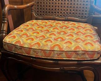Pretty wood chair with cushion.