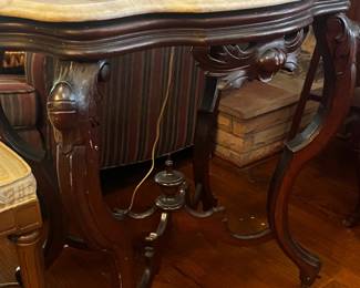 Antique turtle table with white marble top.
