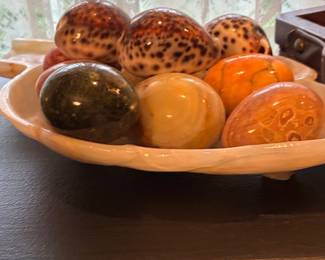 Collection of Polished Stone Eggs and Cowrie Shells in Carved Onyx Dish