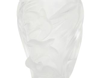 3132 A Lalique glass 'Martinets' vase Late 20th century Designed 1982 by Marie-Claude Lalique (1935-2003) Depicting swallows in high relief Etched: Lalique ® France Height 9 3/4 in., width 8 1/8 in., depth 7 in. Estimate: $100 - $200