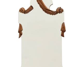 3316 A Continental carved walnut mirror In the manner of Gabriel Viardot, 20th century The frame in the form of fabric swags, crested by turtle doves Height 43 3/4 in., width 20 3/4 in., depth 4 1/2 in. Estimate: $500 - $800