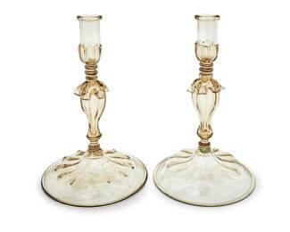 3255 A pair of Murano glass candlesticks Mid-20th century Each unmarked 2 pieces Height of each 14 in.; diameters 9 3/8 in. and 9 in. Estimate: $200 - $400
