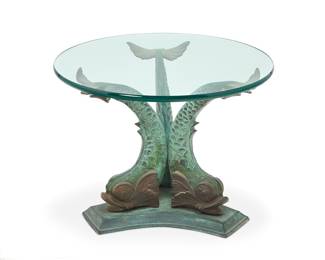 3403 A Neoclassical style verdigris bronze figural occasional table Last quarter 20th century The circular glass top raised on a dolphin-form tripod base Height of base 20 in., width 22 1/2 in., depth 22 1/2 in.; glass diameter 28 1/4 in., thickness 7/8 in. Estimate: $500 - $700