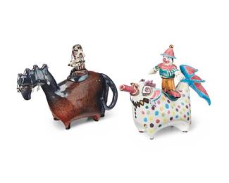 3070 Jeanne Moir (20th/21st Century) Two works: "Bashful & Rider" teapot, 1990s Glazed ceramic and beads Signed: Moir Height 10 in., width 13 1/2 in., depth 5 in. Clown teapot, 1999 Glazed ceramic and beads Signed and dated: Moir 99 Height 10 1/2 in., width 13 5/8 in., depth 4 5/8 in. 2 pieces Estimate: $200 - $400