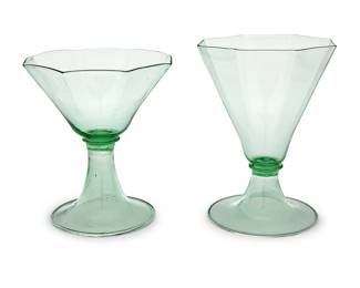 3201 A Venetian green glass part stemware service Early/mid-20th century Comprising seven larger and five shorter goblets Each unmarked 12 pieces Height of each taller 5 3/4 in. approximately; height of each shorter 5 in. approximately Estimate: $200 - $400