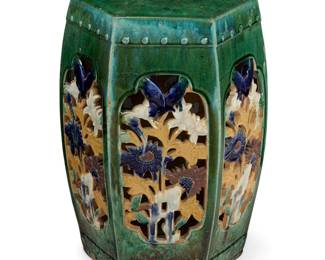 3250 A Chinese polychrome glazed earthenware garden seat 20th century With openwork floral and butterfly designs Unmarked Height 20 in., width 15 1/4 in., depth 13 1/2 in. Estimate: $300 - $500