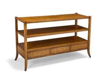 3386 A Baker 'Barbara Barry Collection' console Introduced 1996 With two open shelves above three drawers, raised on flared legs Interior of drawer with applied metal factory tags Height 30 1/2 in., width 48 1/2 in., depth 18 1/2 in. Estimate: $500 - $700