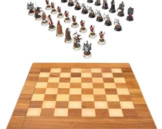 3143 Chas C. Stadden (1919-2002) A painted metal 'Tower of London' chess set with custom table, circa 1978 The complete set of painted metal figurines housed in a custom table with foam-fitted drawer interior 32 pieces Height of tallest piece 5 1/8 in.; height of table 28 in., width 28 1/2 in., depth 29 1/2 in. Estimate: $300 - $500