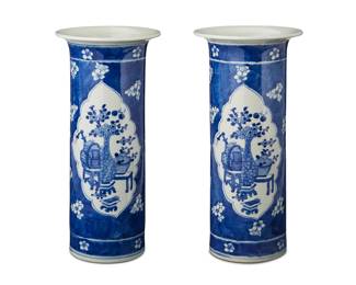 3056 A pair of Chinese Kangxi style blue and white porcelain vases 20th century Each unmarked 2 pieces Height of each 10 7/8 in., diameter 5 1/8 in. Estimate: $400 - $600