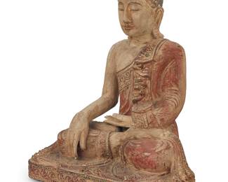3363 A Thai polychrome carved wood Buddha 20th century With hands in Bhumisparsha mudra, inset with glass accents to robe Height 26 1/2 in., width 22 1/2 in., depth 14 in. Estimate: $200 - $400