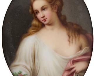 3405 A German painted porcelain portrait plaque Late 19th/early 20th century The oval panel mounted within a velvet slip and pierced Gothic style wood frame Appears unmarked Sight 3 x 2 1/4 in. Estimate: $300 - $400