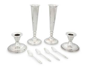 3295 A group of sterling silver table items Early 20th century Comprising a pair of Revere Silversmiths Inc. weighted footed vases, a pair of International weighted candlesticks, and a set of four Wallace 'Stradivari' demitasse spoons Each with factory marks for sterling; vase numbered: 697; each candlestick numbered: 11615/3; each spoon monogrammed 'F' 8 pieces Height of vases 8 in., diameter 3 in.; height of candlesticks 3 in., diameter 3 1/2 in. Total weighable sterling 1.1 oz. troy approximately Estimate: $700 - $900
