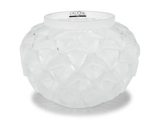 3335 A Lalique glass 'Languedoc' vase Late 20th/early 21st century Originally designed 1929 Etched: Lalique ® France; with applied factory label Height 4 3/4 in., diameter 6 5/8 in. Estimate: $400 - $600