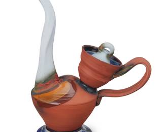 3069 Woody Hughes (20th/21st Century) A studio ceramic teapot, circa 1993 Partially glazed Incised signature to underside: W Hughes Height 14 1/2 in., width 11 1/8 in., depth 6 1/4 in. Estimate: $200 - $400