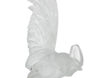 3097 A Lalique glass 'Coq Nain' paperweight Late 20th century Originally designed 1928 as a car hood mascot Etched: Lalique France Height 8 1/8 in., width 5 1/4 in., depth 2 3/4 in. Estimate: $200 - $300