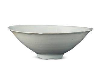 3005 A Korean celadon glazed ceramic bowl Goryeo Dynasty (918-1392) With lobed edge Height 2 1/2 in., diameter 7 1/4 in. Estimate: $300 - $500