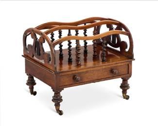 3161 A Victorian mahogany canterbury Second half 19th century With barley twist supports and opposed openwork lyre-form sides above a single drawer with turned knobs, raised on turned legs with casters Height 18 1/2 in., width 21 in., depth 16 3/4 in. Estimate: $300 - $500