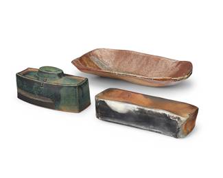 3355 Three studio pottery items Late 20th/early 21st century Comprising a glazed earthenware large tray, a glazed lidded box, and a closed box Closed box impressed with Asian chop mark 3 pieces Height of tray 2 7/8 in., width 16 1/2 in., depth 8 7/8 in.; height of lidded 4 1/2 in., width 9 1/4 in., depth 4 1/8 in. Estimate: $200 - $400