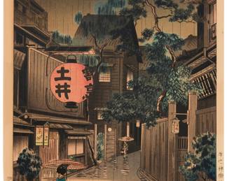3006 Tsuchiya Koitsu (1870-1949) "Ushigome Kagurazaka," 1939 Woodcut in colors on laid Japanese paper From the edition of unknown size and date With the printed black ink signature and the artist's red ink seal in the image at lower right; with other printed Japanese inscriptions in the left and right margins and an unidentified blindstamp in the upper left corner; Harada/Yokio, prntr.; Doi Hangaten, pub. Image: 15 1/2 x 10 1/4 in; Sheet: 16 5/8 x 11 1/8 in. Estimate: $200 - $300