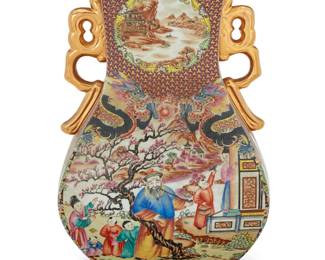 3178 A Chinese Export style porcelain vase 20th century Decorated with figural tableaux, with gilt-painted handles Undeciphered painted mark and applied label to underside Height 18 1/2 in., width 11 7/8 in., depth 9 1/2 in. Estimate: $300 - $500