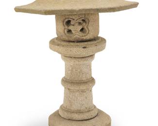 3048 A Japanese stone ishi doro garden lantern 20th century The hexagonal umbrella above a round fire box, raised on a columnar support 5 pieces Height overall 39 in., width 30 1/2 in., depth 27 in. Estimate: $300 - $500