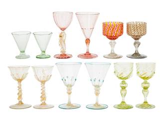 3129 A group of twelve Murano wine glasses Mid-20th century Comprising five near-pairs and two singles, most with gold flake inclusions Each unmarked 12 pieces Height of tallest 6 1/8 in.; height of shortest 3 1/2 in. Estimate: $300 - $500