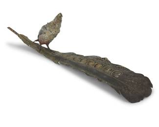 3344 Franz Bergman (1861-1936) A cold-painted bronze figural inkwell, early 20th century The well in the form of a cockatoo, perched on a long feather Twice impressed with maker's foundry mark, once impressed: DEPOSE Height 5 1/8 in., length 19 5/8 in., width 4 5/8 in. Estimate: $400 - $600