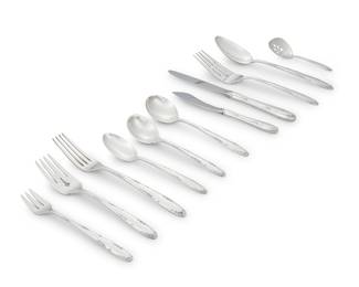 3182 A Towle sterling silver 'Madeira' flatware service Second half 20th century Designed 1948 Comprising: 6 dinner knives 8 butter spreaders 6 dinner forks 6 salad forks 10 cocktail forks 4 cream soup spoons 6 teaspoons 2 table spoons 1 master butter knife 1 sugar spoon 1 pierced bonbon spoon 1 serving fork Each with factory marks for sterling 52 pieces Total weighable sterling 48 oz. troy approximately Estimate: $1,500 - $2,500