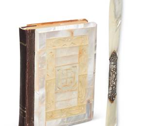 3353 A mother of pearl New Testament pocket bible and letter opener 20th century Comprising: "The Red Letter New Testament." London and New York: Collins' Clear-Type Press The Buckram binding later adorned with shell and mother of pearl Height 4 7/8 in., width 3 5/8 in., depth 7/8 in. A mother of pearl letter opener with sterling silver repoussé handle Handle marked: STERLING Length 7 7/8 in. 2 pieces Estimate: $200 - $300