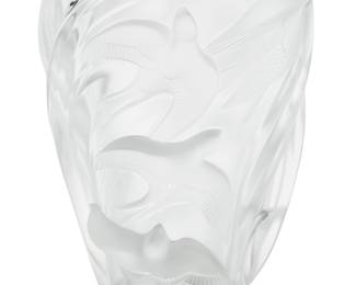 3368 A Lalique glass 'Martinets' vase Late 20th century Designed 1982 by Marie-Claude Lalique (1935-2003) Depicting swallows in high relief Etched: Lalique ® France; with factory labels, numbered: 12308 Height 9 3/4 in., width 8 1/8 in., depth 7 in. Estimate: $400 - $600