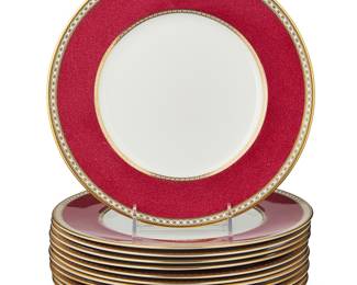 3210 A set of twelve Wedgwood 'Ulander Powder Ruby' porcelain dinner plates Post 1962 Designed 1927 Each with black and gilt printed factory marks and pattern name, numbered: W1813 12 pieces Diameter of each 10 3/4 in. Estimate: $300 - $500