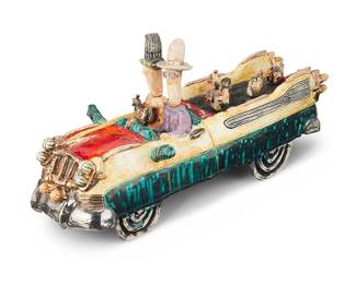 3087 Scott & Naomi Schoenherr (b. 1962 & b. 1966) A glazed ceramic car with figures, late 20th/early 21st century Incised to underside: Schoenherr Height 9 1/2 in., width 19 3/4 in., depth 7 1/4 in. Estimate: $500 - $700