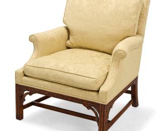 3212 A Minton-Spidell George III style mahogany armchair Late 20th century With carved wood legs and stretchers, upholstered in a pale green cotton fabric with foliate designs Factory label applied to underside Height 37 in., width 32 in., depth 35 in. Estimate: $400 - $600