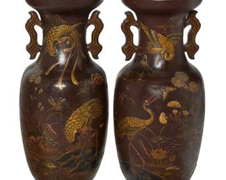 3106 A pair of Japanese style painted ceramic floor vases mounted as uplights 20th century With ruyi-form handles, each decorated in relief with cranes, butterflies, and foliage in a pond vignette, each housing a single light, electrified Each unmarked 2 pieces Height of each 32 in., diameter 13 1/4 in. Estimate: $300 - $400